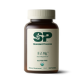 Image of E-Z Mg bottle next to tablets of magnesium supplements.