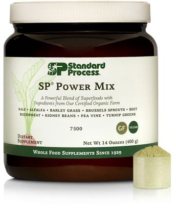 Tub of SP Power Mix next to a scoop of the green powder.